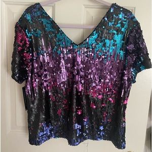 Never worn sequins top. So pretty but a little short for me.